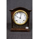 Edwardian Sessions mantel clock with numeral dial, brass bezel and carved foliate case, 29cm in