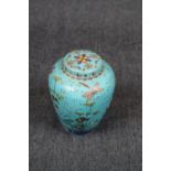 19thC Chinese Lidded Jar decorated with Butterflies and flora with blue ground base, Under glaze