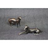 2 Early 20thC Bronze figures of Greyhounds one standing the other laying, 22cm and 16cm in Length