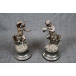 Pair of Victorian Spelter Spill vases with Dancing children decoration against naturalistic base,