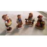 Four Hummel figures