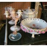 A pair of German porcelain cherub candlesticks, impressed K. Tutter (one a/f), Victorian lidded