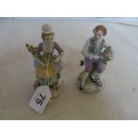 A pair of German porcelain figures man and lady with flowers.
