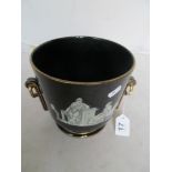 A Victorian jardinière black ground with en grisaille classical figures gilt handles and detail