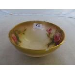 A Royal Worcester bowl hand painted roses (chip to rim)