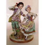 A German porcelain figure group man and lady dancing.