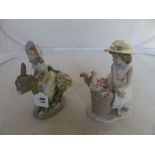 A Lladro figure girl riding donkey with baskets of flowers, and another girl with squirrel on basket