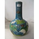 A late 19th Century oriental vase blue ground with raised design of lilies and cranes blue seal mark