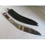 A curved Eastern sword in leather scabbard.