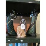 A pair of Art Deco style resin figures dancing couples and another lady seated on rock