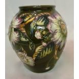 A modern Moorcroft vase green ground with flowers '98