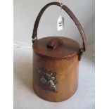 A leather bucket with armorial and liner