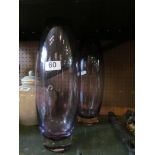 A pair of tall LSA amethyst coloured glass vases