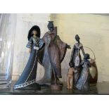 A resin figure African lady, three other figures and an oak and plated biscuit barrell