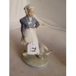 A Royal Copenhagen model of lady with goose.