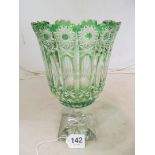 A cut glass green overlay vase