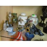 Four pottery figures oriental gentlemen, pair of ginger jars and a kylin lion