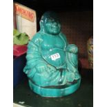 A turquoise pottery Buddha