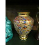 A Decorium gilt glass vase