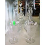 A pair of small cut glass decanters and two goblets