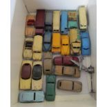 A group of Dinky cars and trucks in used condition