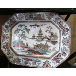 A large ironstone meat plate decorated pagoda scenes