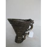 A bronze Libation cup