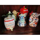 A Morley teapot, telephone teapot, postbox teapot, two jugs and barrel