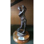 A bronze effect figure golfer