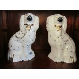 A pair of Royal Doulton Staffordshire dogs