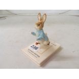 A Beswick Peter Rabbit on book