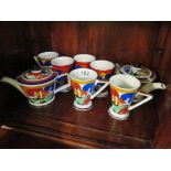 Six Clarice Cliff style cups and two teapots