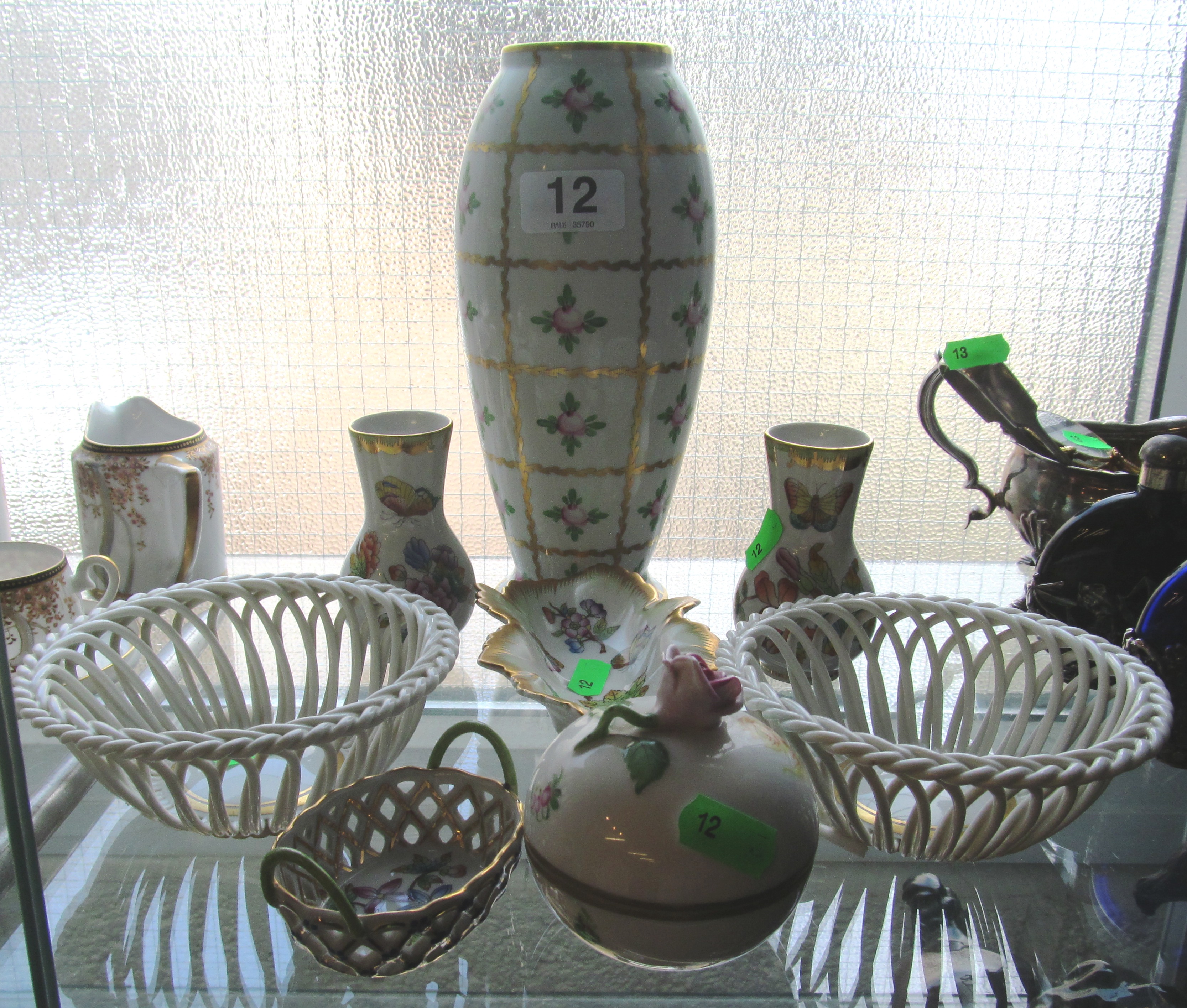 A pair of Herend porcelain vases, rose design vase, two dishes, lidded pot and pair of pierced