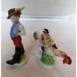 Two Herend porcelain figures man riding on cockerel and another boy with big boots