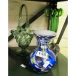 A green glass pierced basket and two coloured glass vases,