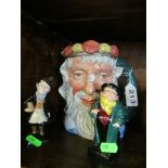 A Royal Doulton character jug Neptune and two Dickens figures Tony Weller and Trotty Veck