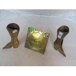 A pair of brass boot spill holders and brass calender.