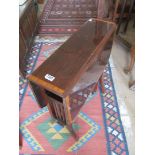 An Edwardian mahogany and satinwood banded Sutherland table