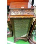 A Victorian mahogany specimen/sewing cabinet of eleven drawers behind glass door and two further