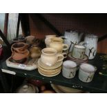 A stoneware teapot, large lidded pot and other stoneware pieces.