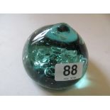 A bubble glass paperweight with flat bottom