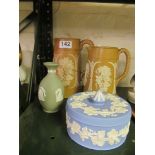 A Wedgwood blue jasperware lidded dish, green jasperware vase and two stoneware jugs