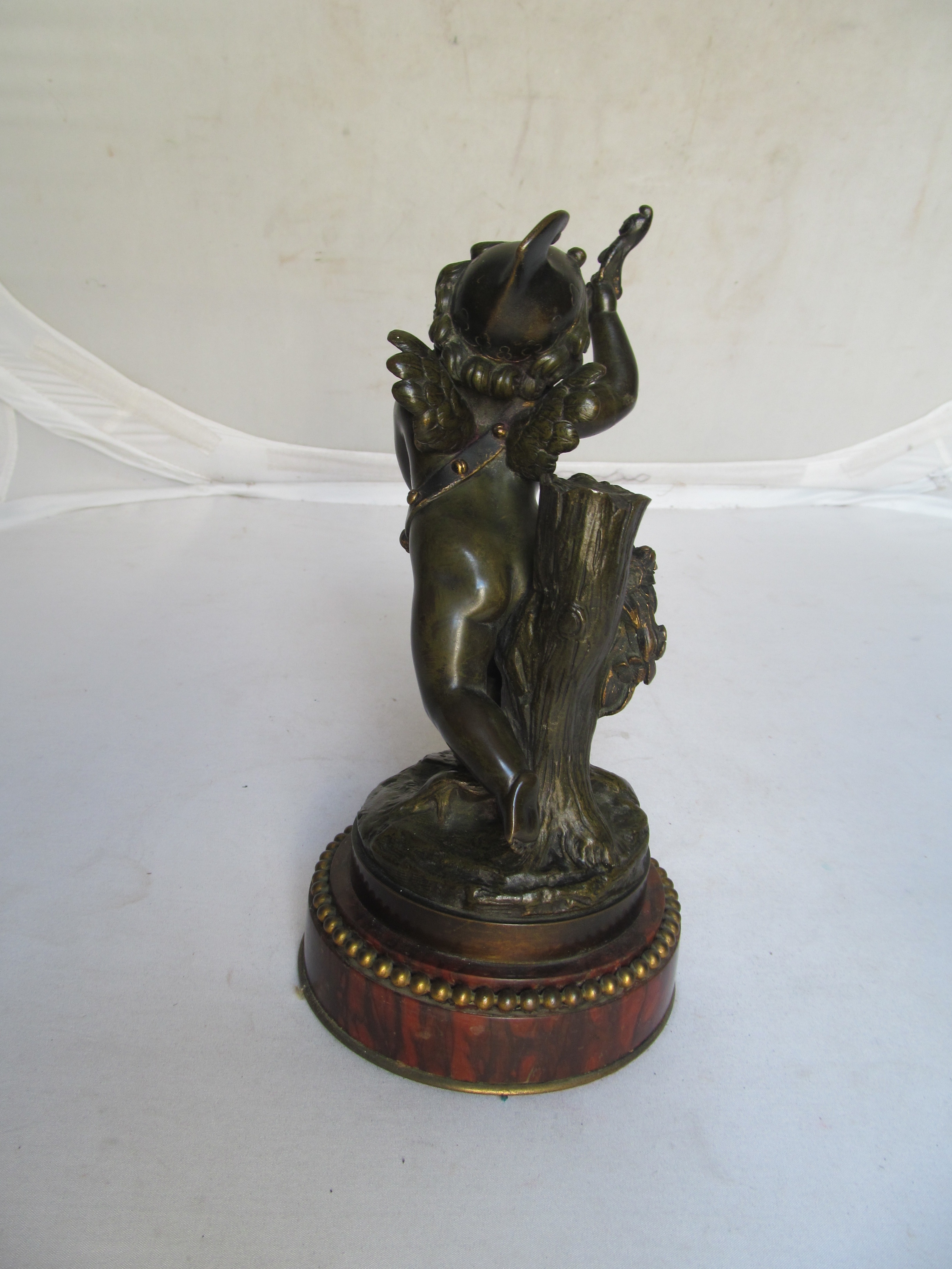 A pair of 19th Century French bronze cherubs one playing drum and carrying a pipe the other a - Image 8 of 10