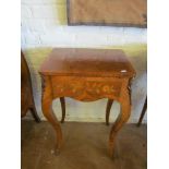 A Louis XV style table with drawer on cabriole legs and inlaid floral design