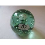 A large bubble glass paperweight