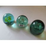 Three floral paperweights