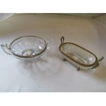 A glass dish with gilt rim and mask handles, a Val St. Lambert glass dish with white metal rim and a