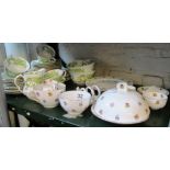 An Aynsley part breakfast set and a part green teaset