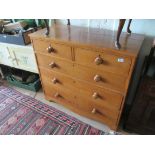 An oak chest of two short and three long drawers