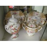 A pair of Victorian floral plates and matching sucrier and another lidded vase